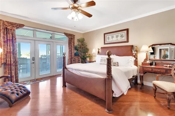 a bed room with a bed and a chandelier