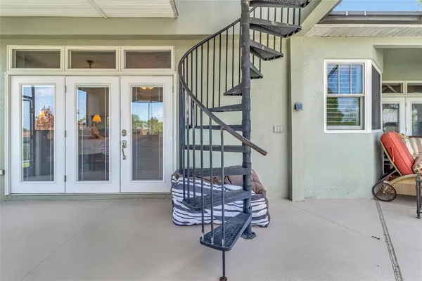 a view of entryway with a lots of windows and couch