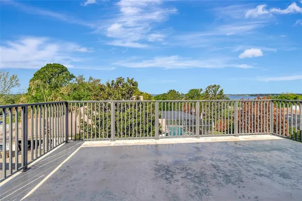 a backyard of a house with yard fire pit table and chairs