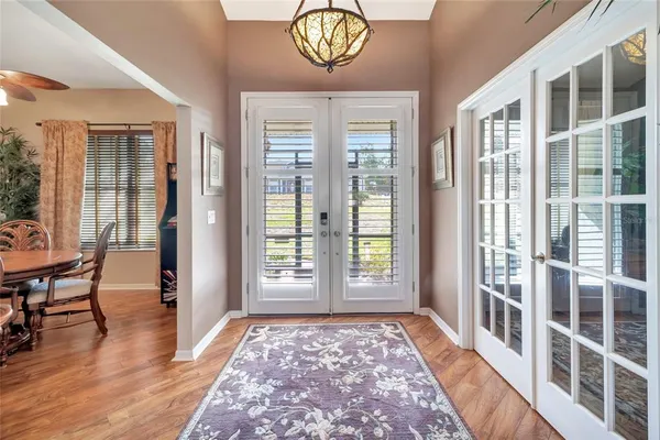 a view of an entryway with wooden floor