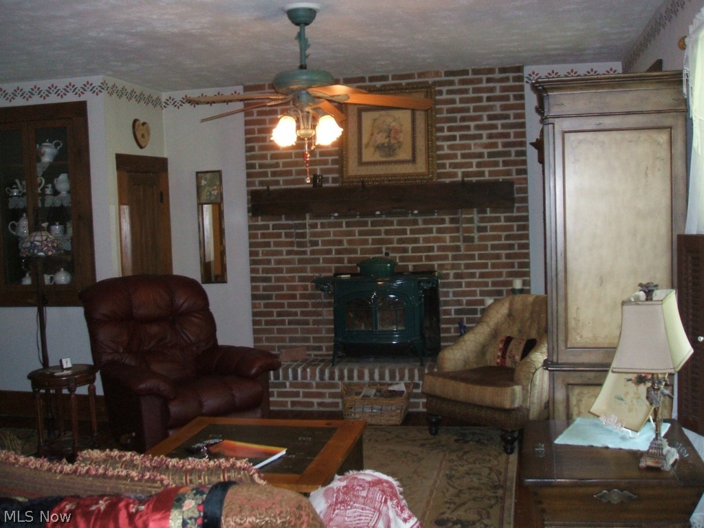 2118 North Medina Line Road Akron, OH 44333 - Photo 4 of 25 Family room with fireplace overlooks front porch