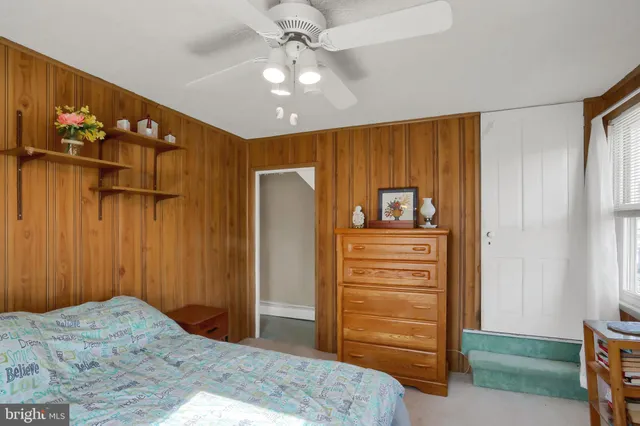 a bedroom with a bed and cabinets