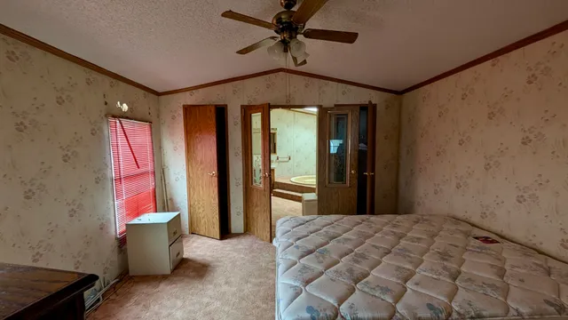 a bedroom with furniture and window