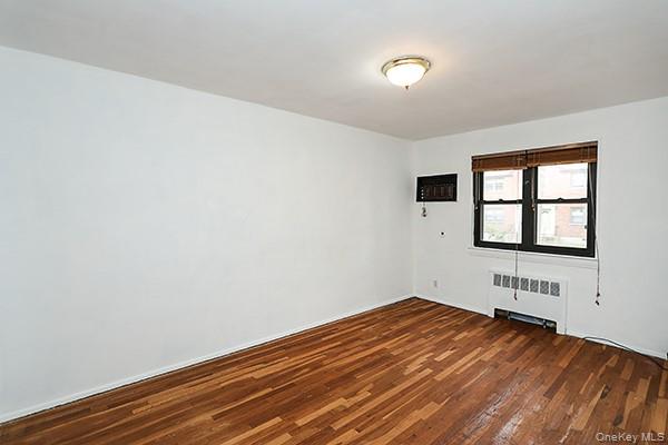 57-54 244th Street, Unit LOWR Queens, NY 11362 - Photo 6 of 6 an empty room with window
