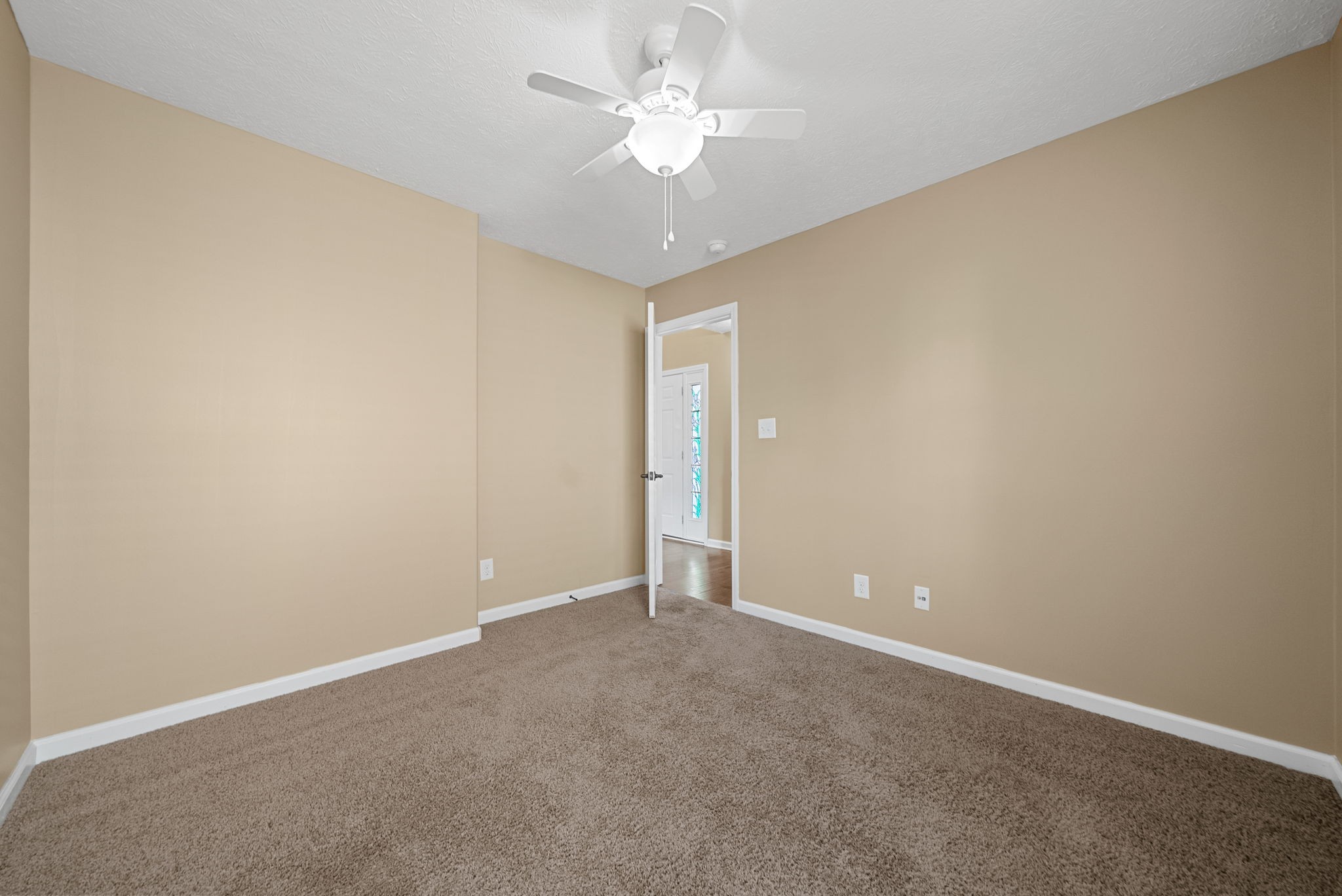 3783 Suiter Road Clarksville, TN 37040 - Photo 24 of 31 an empty room with a chandelier fan and a chandelier fan