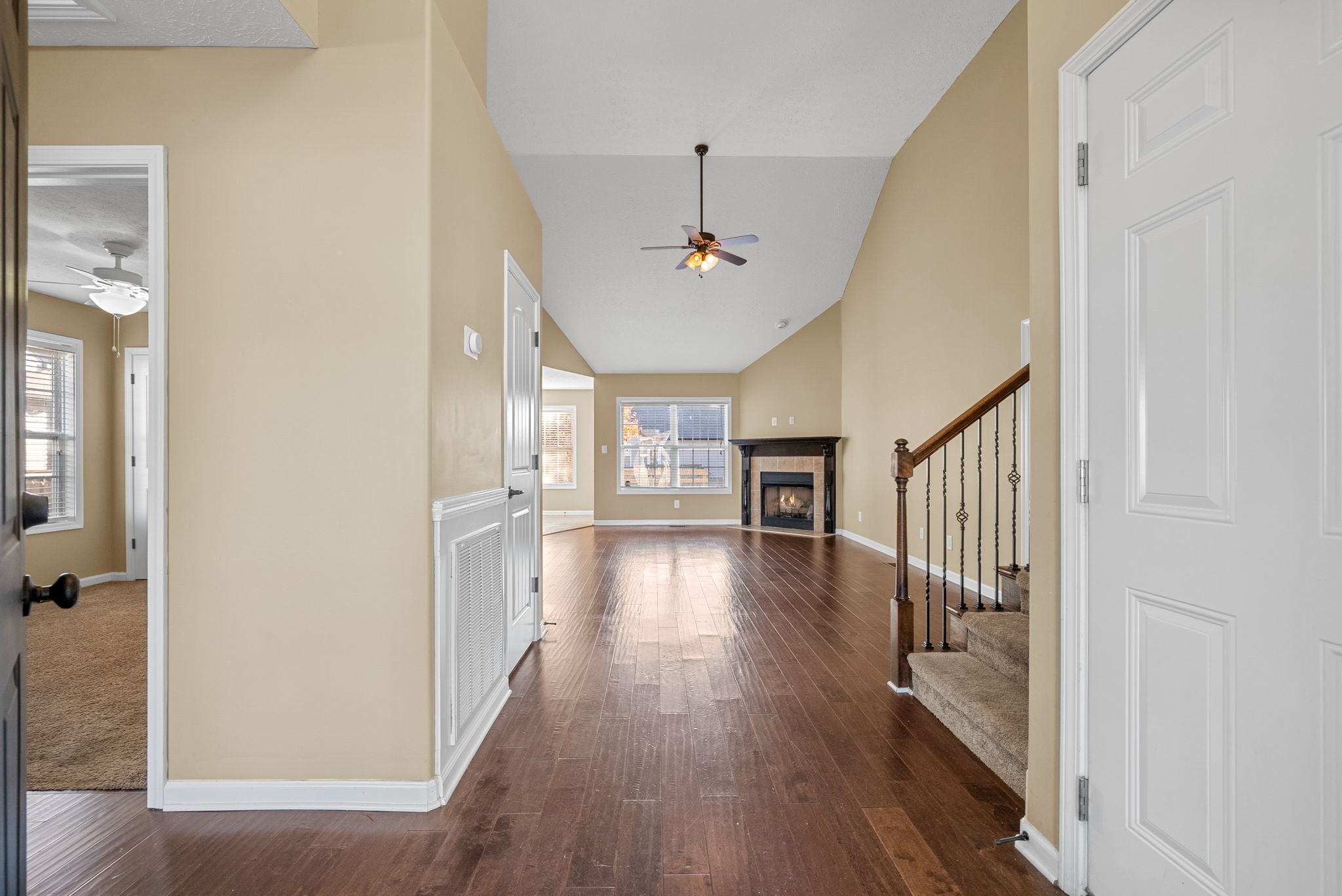3783 Suiter Road Clarksville, TN 37040 - Photo 4 of 31 a view of a hallway with wooden floor and a livingroom