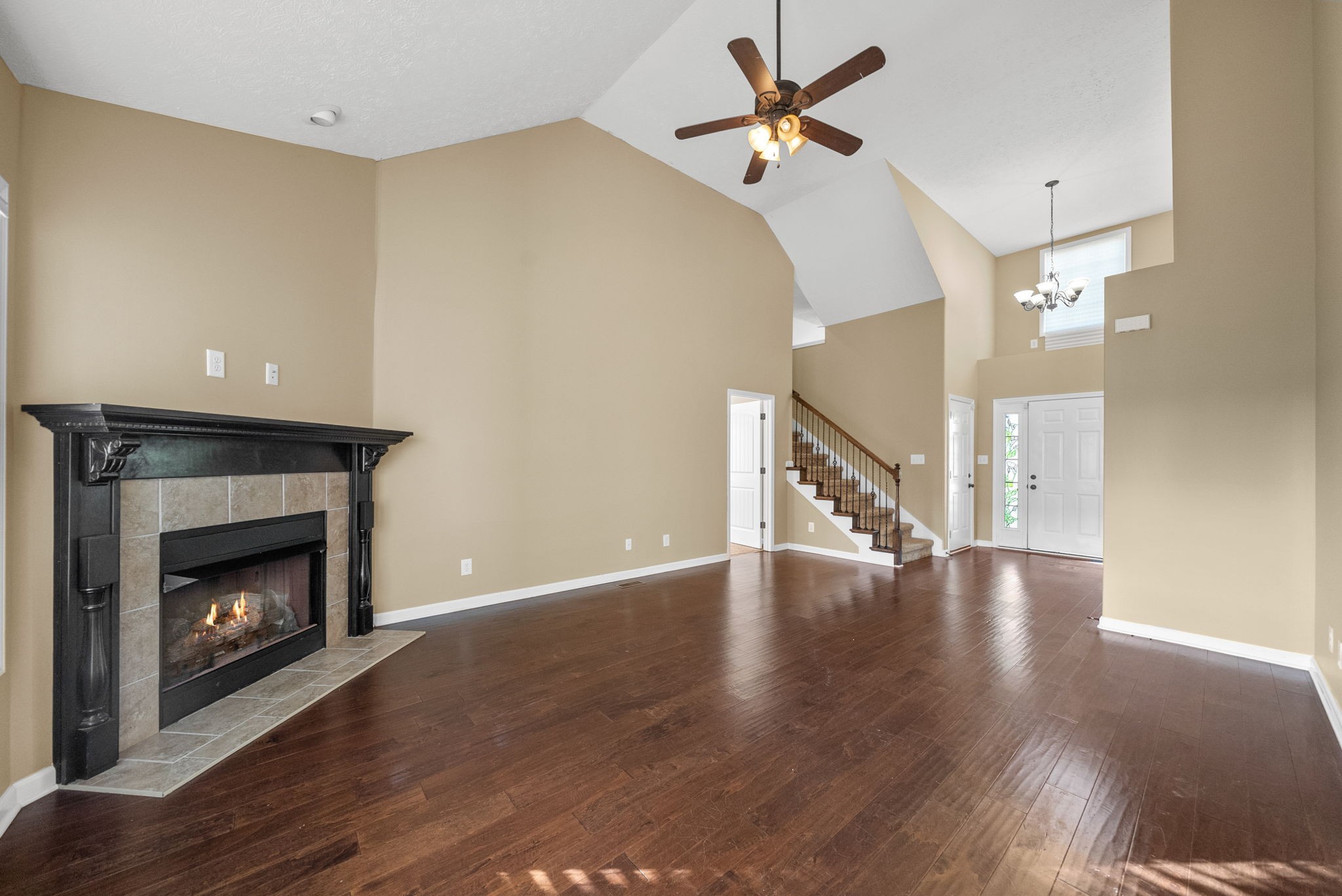 3783 Suiter Road Clarksville, TN 37040 - Photo 9 of 31 a view of an empty room with wooden floor a fireplace