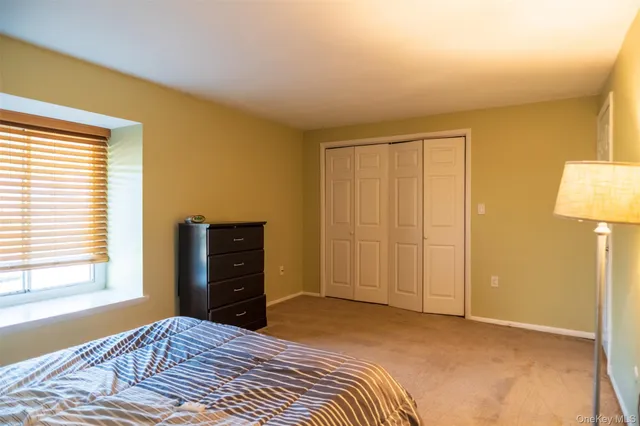 a bedroom with a bed and lamps