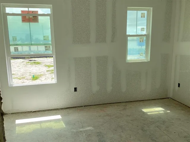 an empty room with windows