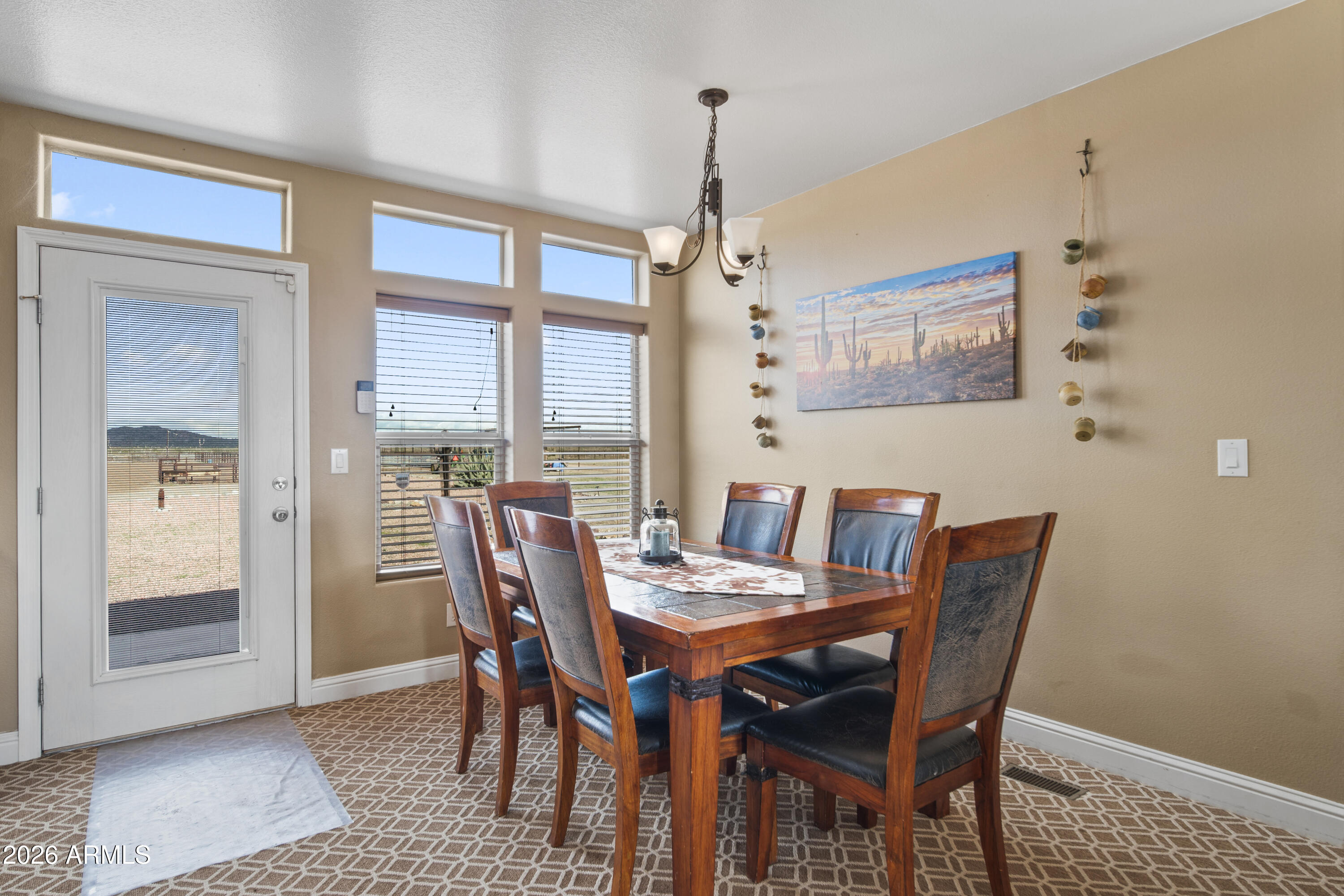 46109 West J-1 Ranch Road Wickenburg, AZ 85390 - Photo 12 of 32 a view of a dining room with furniture