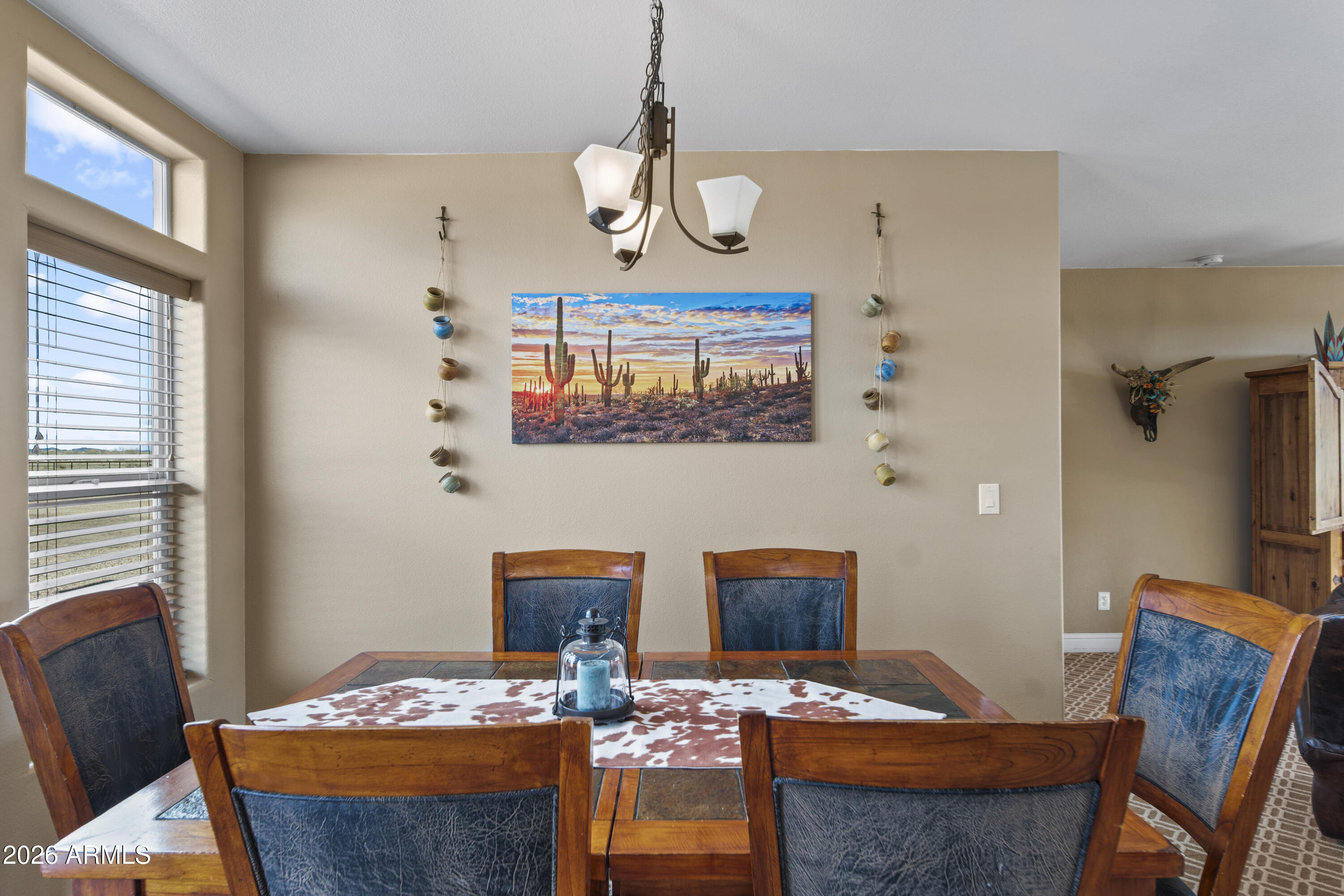 46109 West J-1 Ranch Road Wickenburg, AZ 85390 - Photo 13 of 32 a view of a dining room with furniture