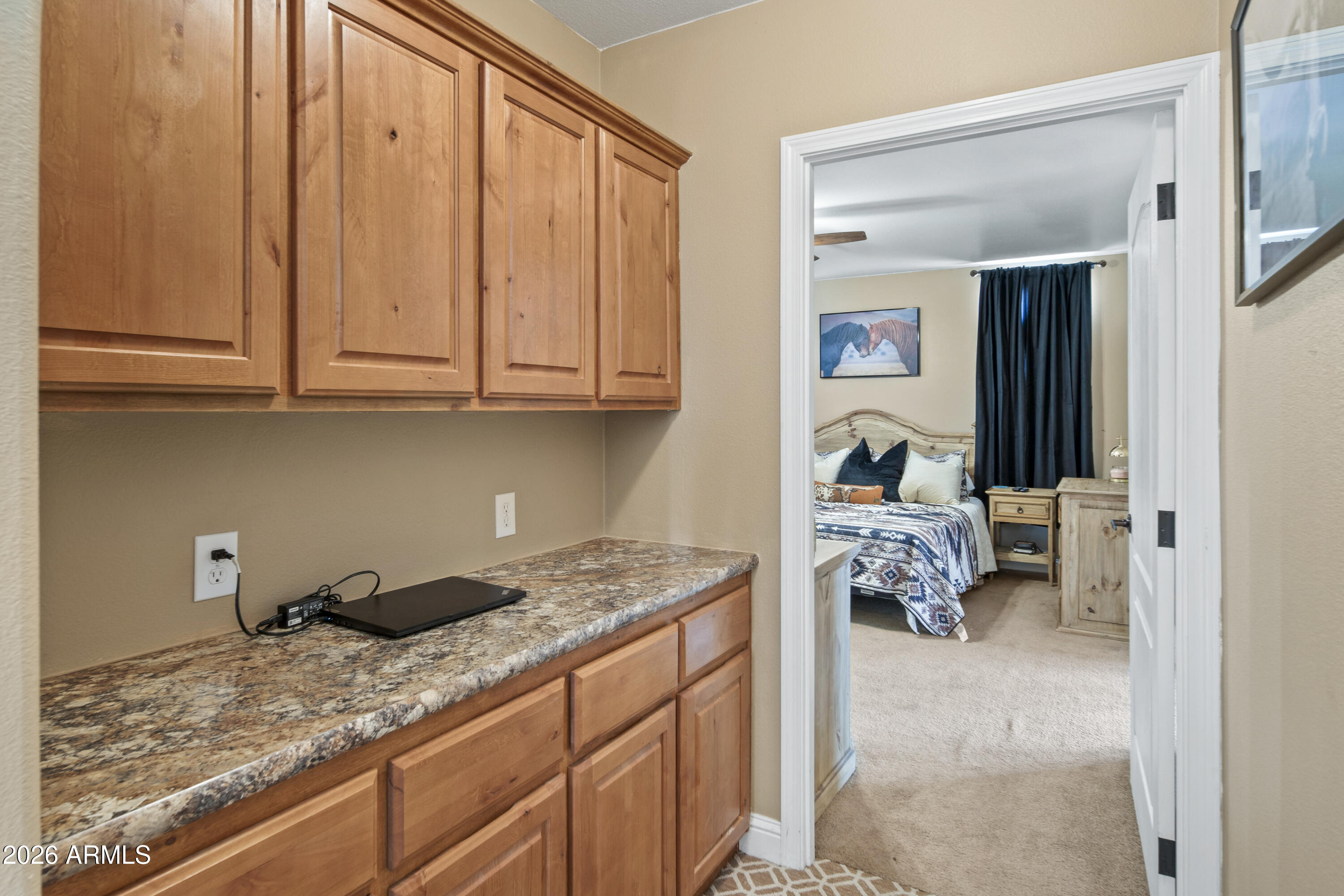46109 West J-1 Ranch Road Wickenburg, AZ 85390 - Photo 18 of 32 a bedroom with a bed and a window
