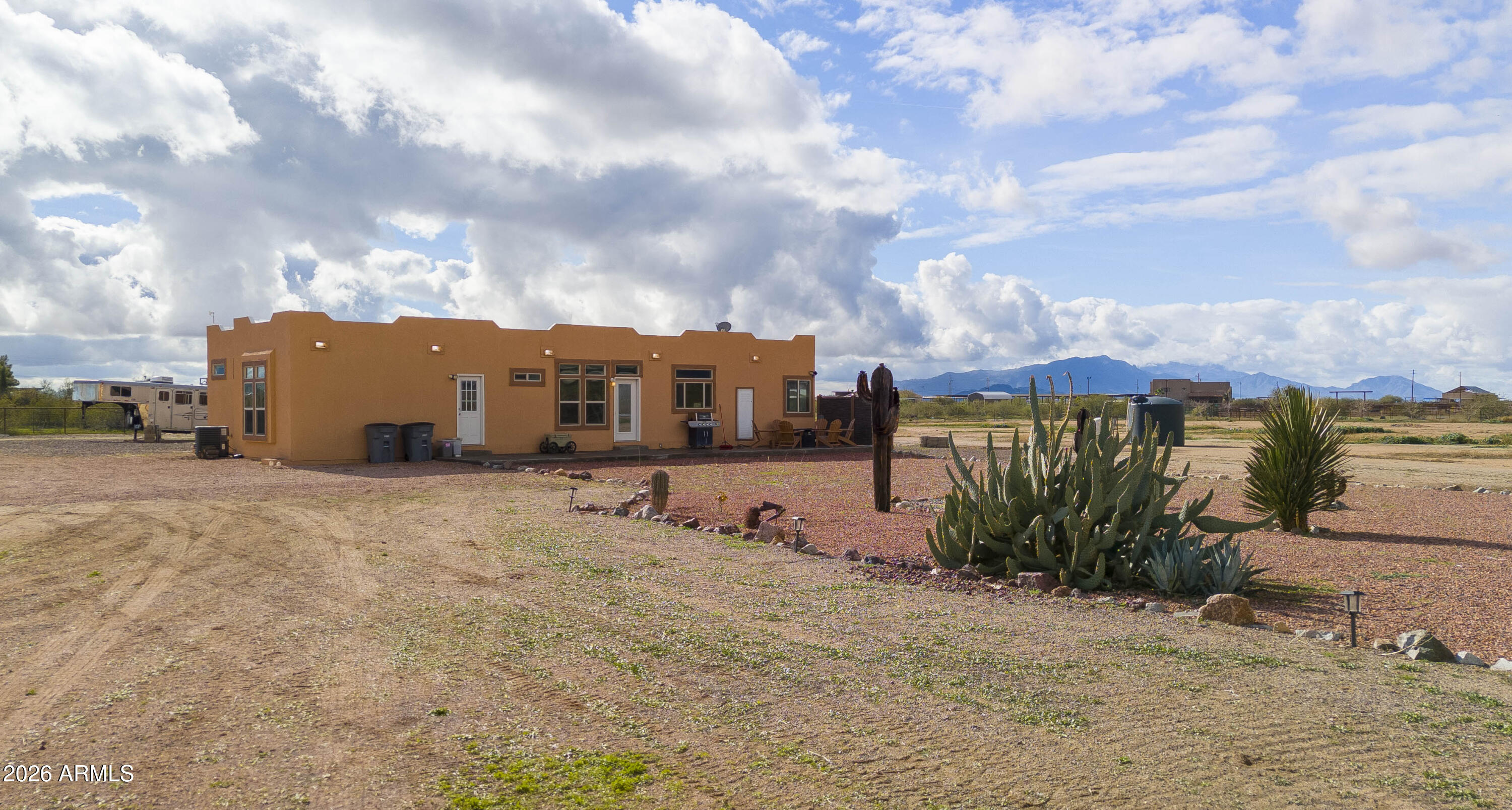 46109 West J-1 Ranch Road Wickenburg, AZ 85390 - Photo 2 of 32 a view of a house with a yard