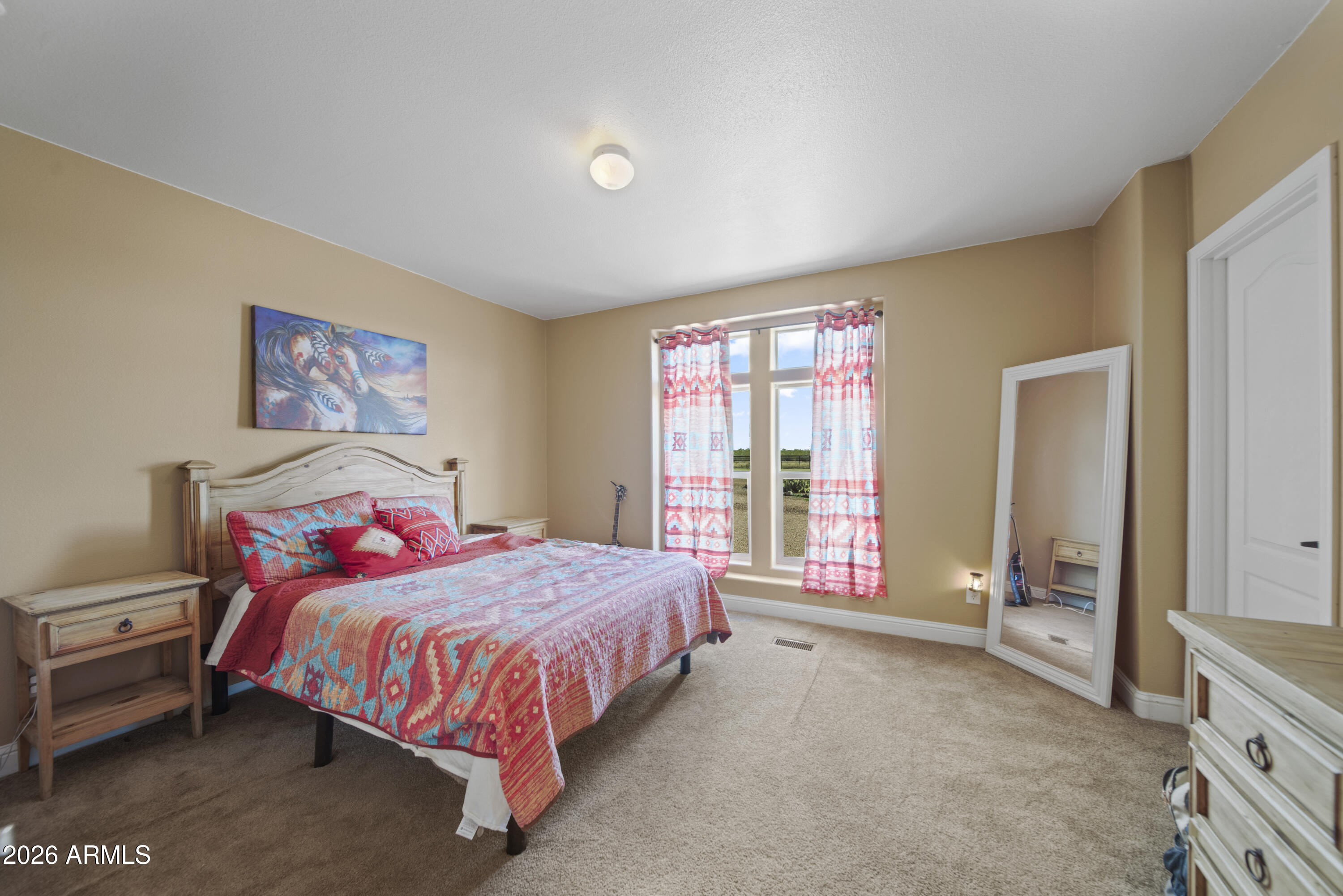 46109 West J-1 Ranch Road Wickenburg, AZ 85390 - Photo 23 of 32 a bedroom with a bed and a window