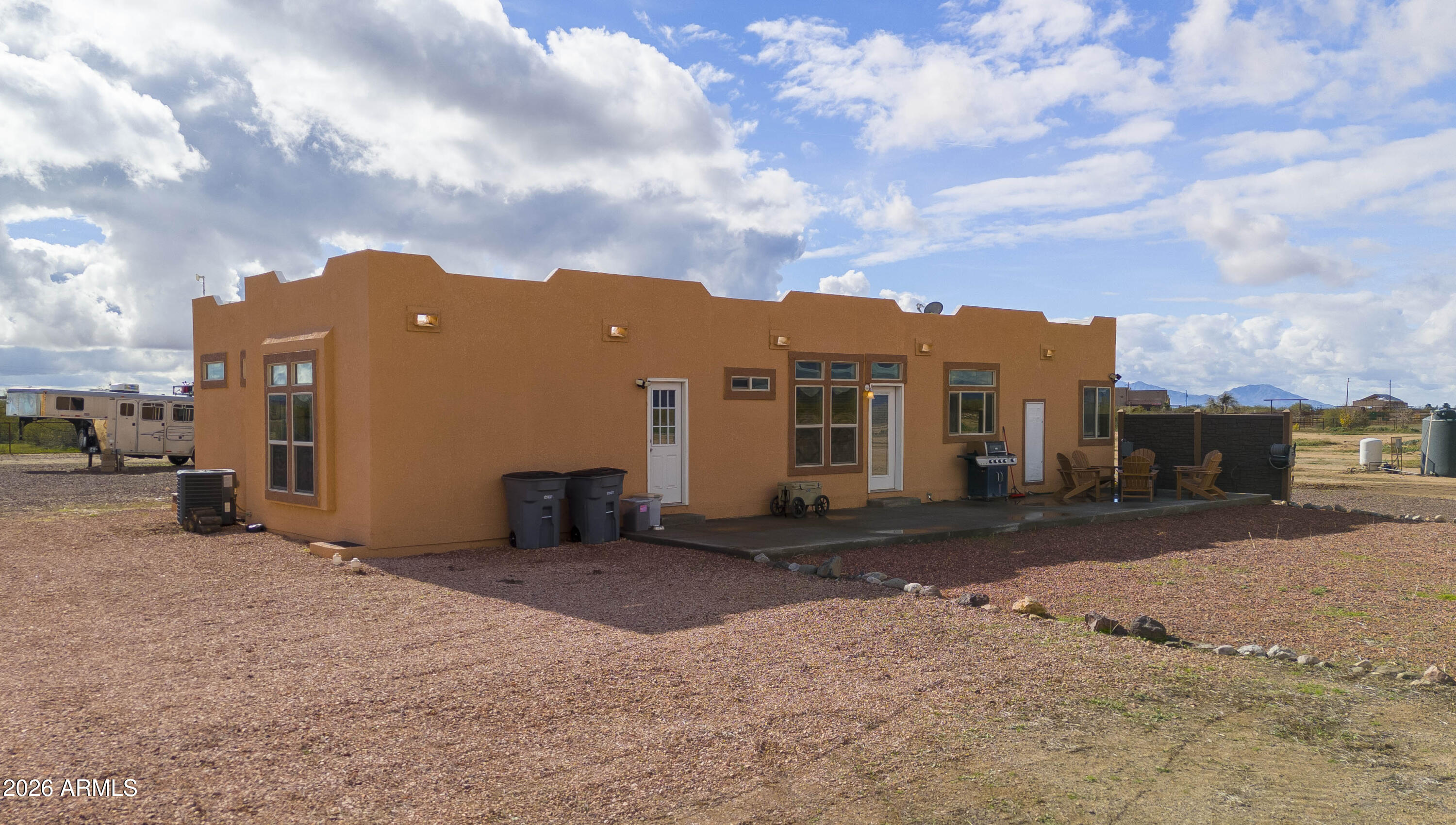 46109 West J-1 Ranch Road Wickenburg, AZ 85390 - Photo 3 of 32 a view of a street with a building in the background