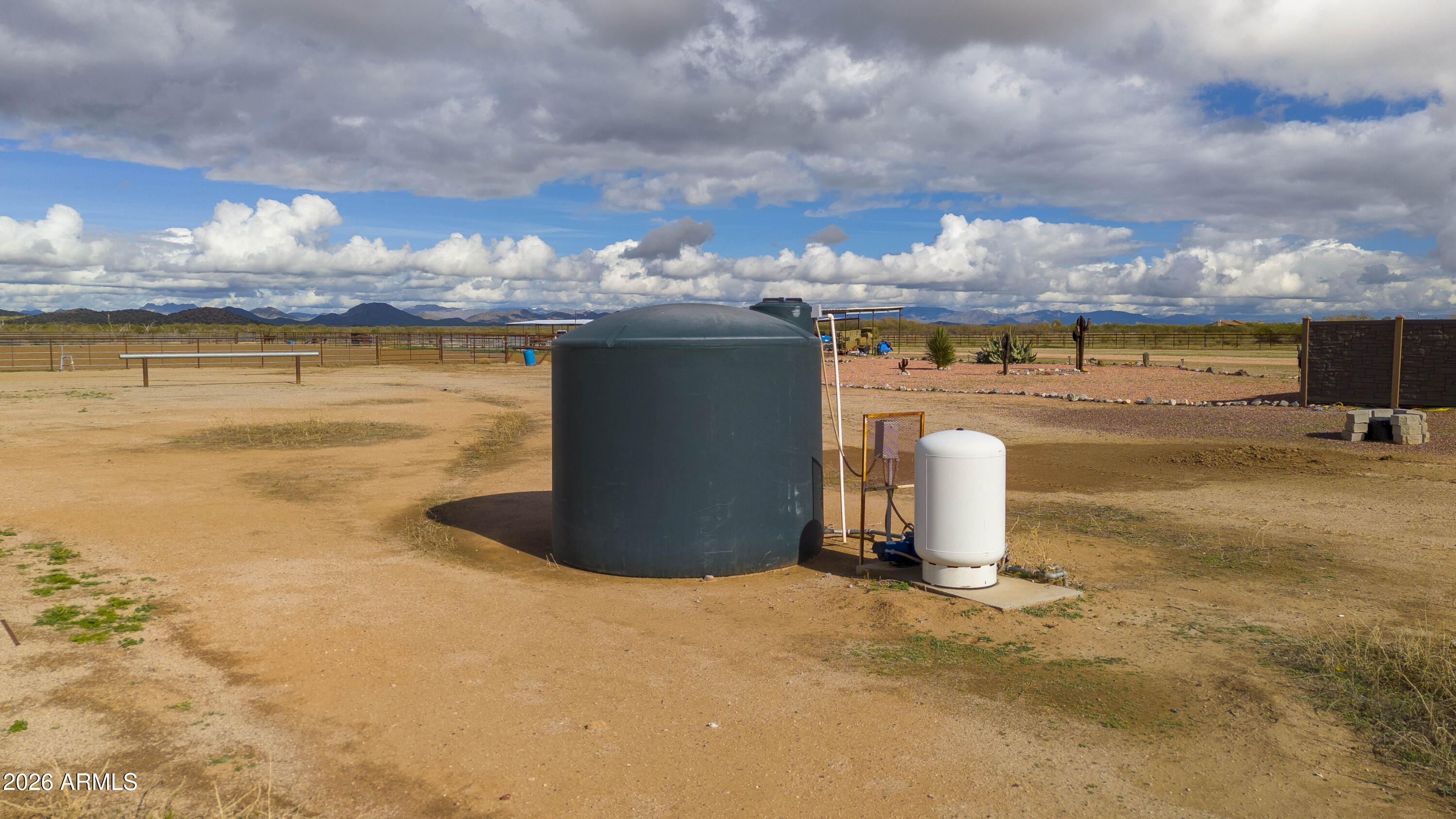 46109 West J-1 Ranch Road Wickenburg, AZ 85390 - Photo 5 of 32 a view of a swimming pool and an outdoor seating