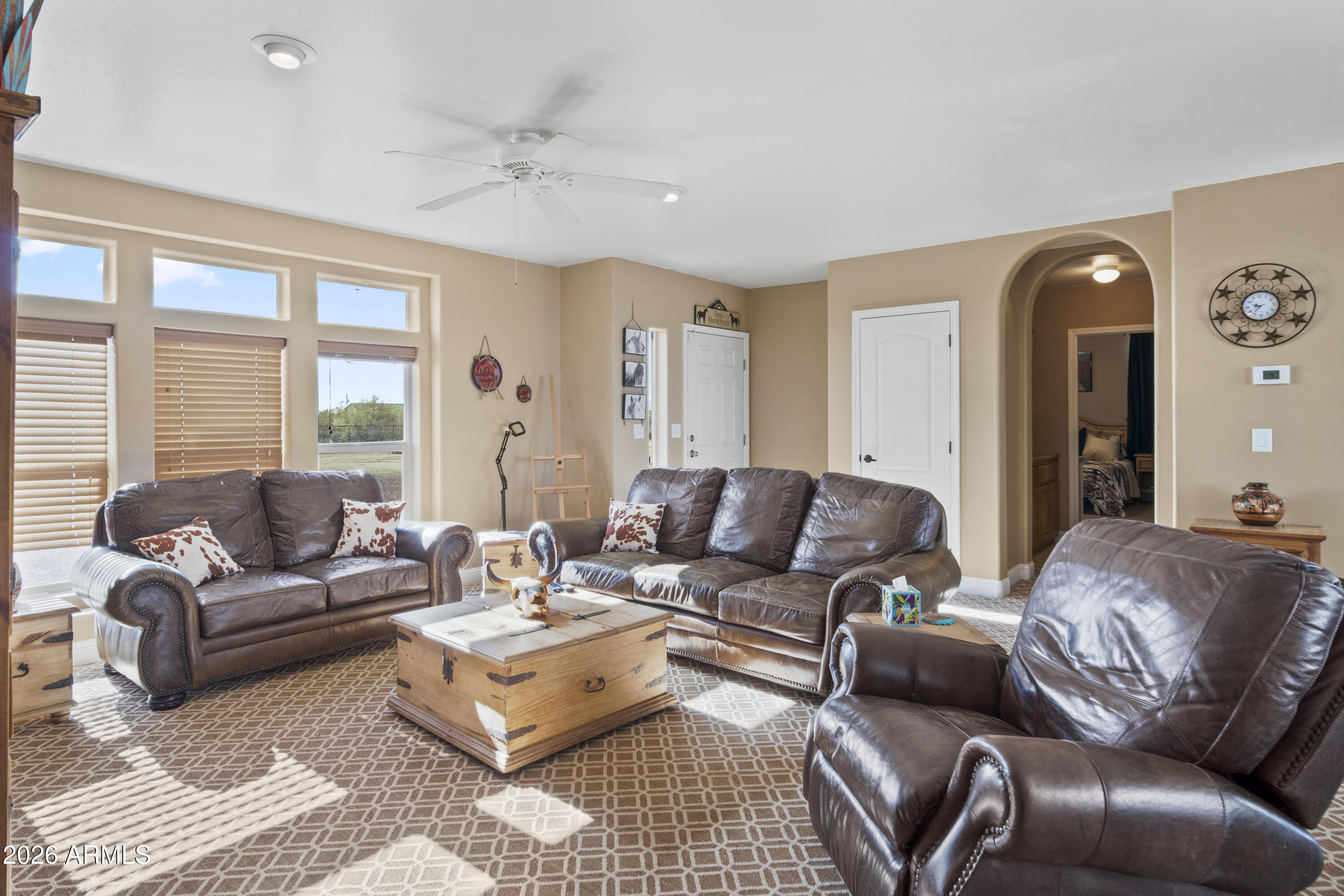 46109 West J-1 Ranch Road Wickenburg, AZ 85390 - Photo 8 of 32 a living room with furniture and a large window