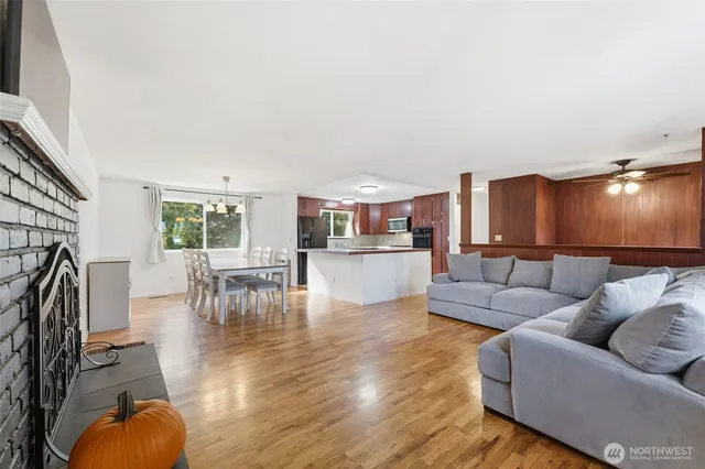 a kitchen with stainless steel appliances granite countertop a sink and a refrigerator