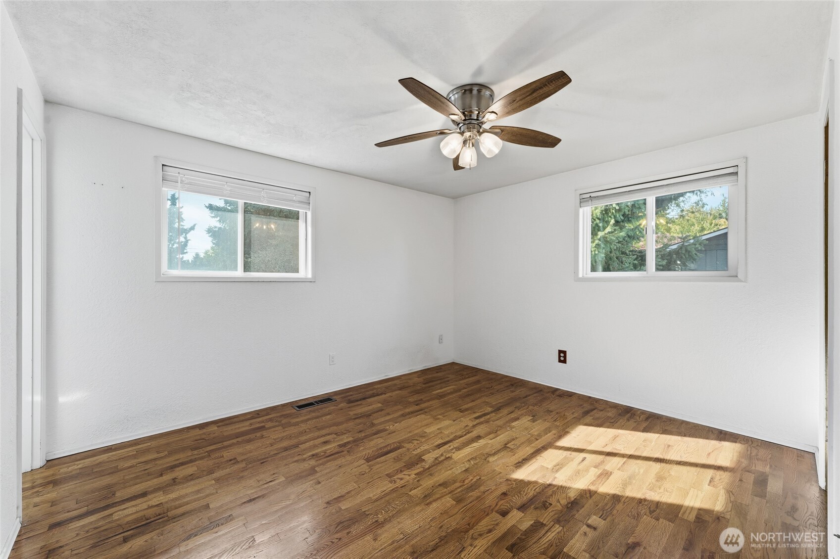 945 Frazier Drive Walla Walla, WA 99362 - Photo 21 of 38 a view of empty room with wooden floor