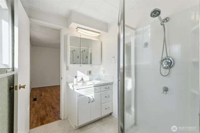 a bathroom with a sink toilet and shower