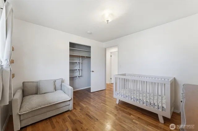 a workspace with wooden floor and a window