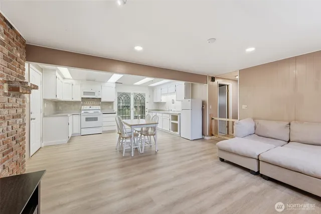 a kitchen with a sink cabinets and stainless steel appliances