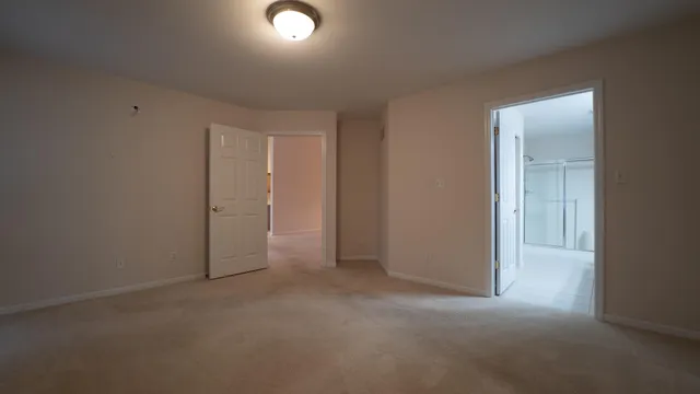 an empty room with closet area