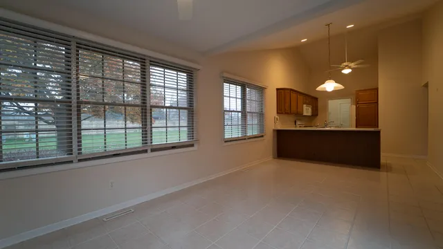 a view of an empty room with a window