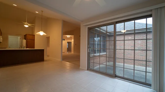 a view of a room with a large window