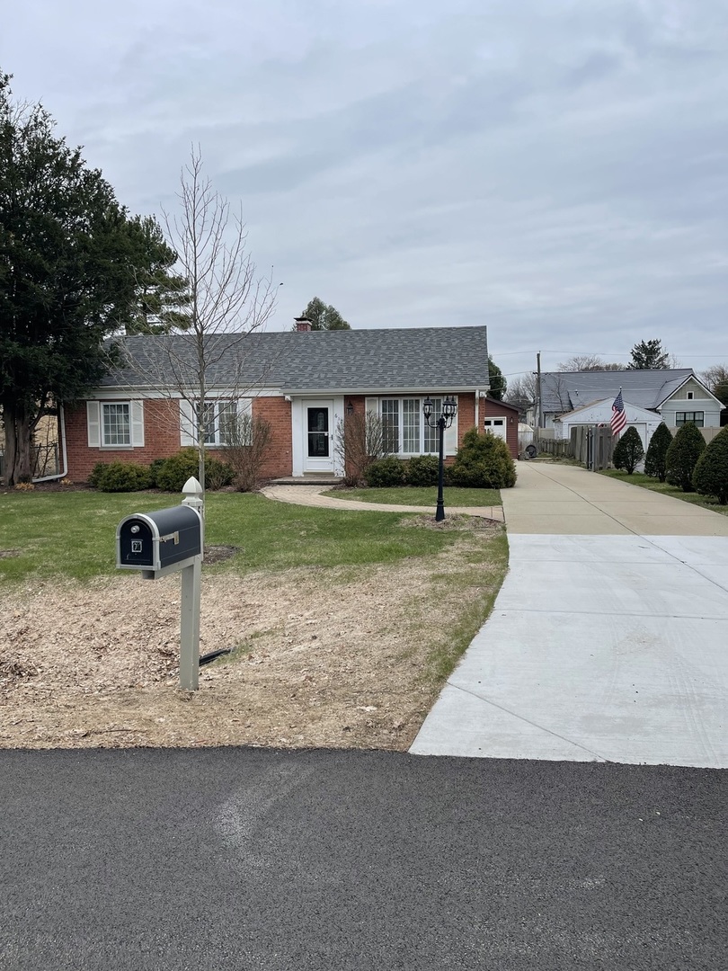 617 West Bob O Link Road Mount Prospect, IL 60056 - Photo 1 of 18 front view of a house with a yard