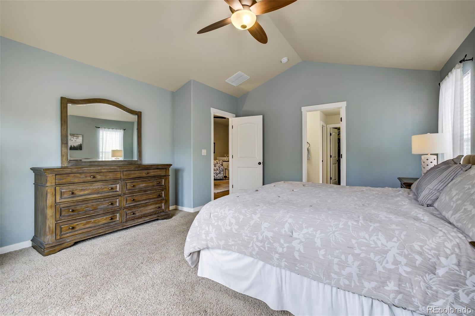 4970 Rabbit Mountain Court Colorado Springs, CO 80924 - Photo 17 of 50 a bedroom with a bed and a dresser