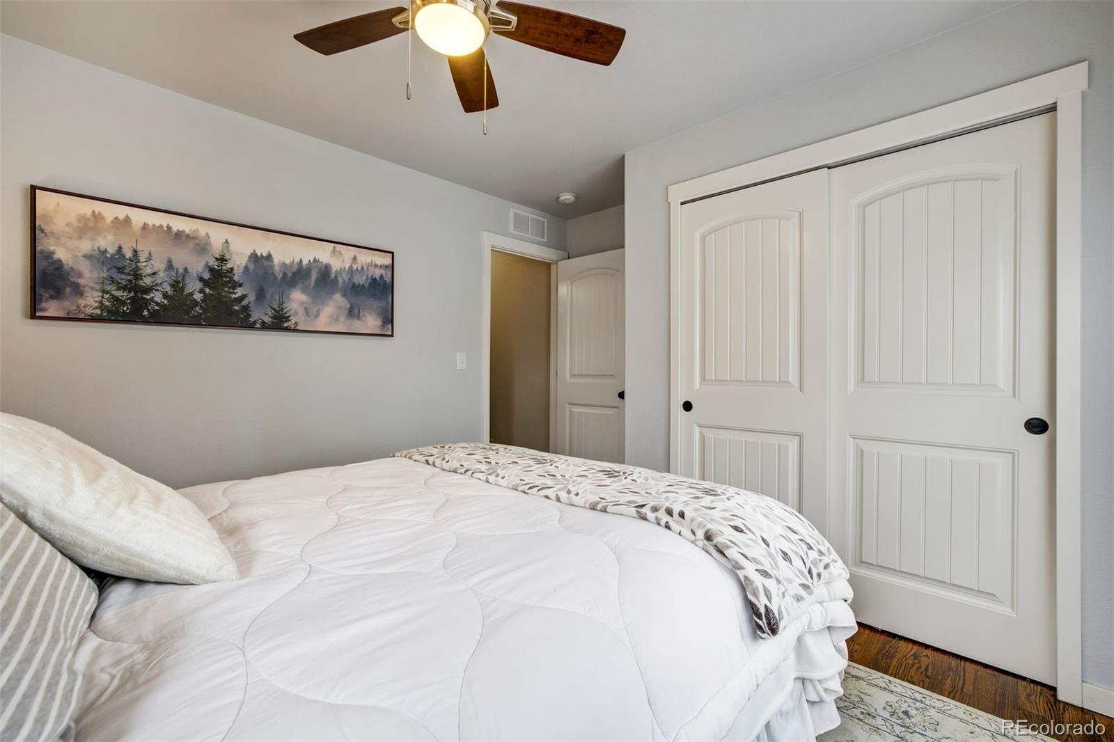 4970 Rabbit Mountain Court Colorado Springs, CO 80924 - Photo 22 of 50 a large white bed in a white room