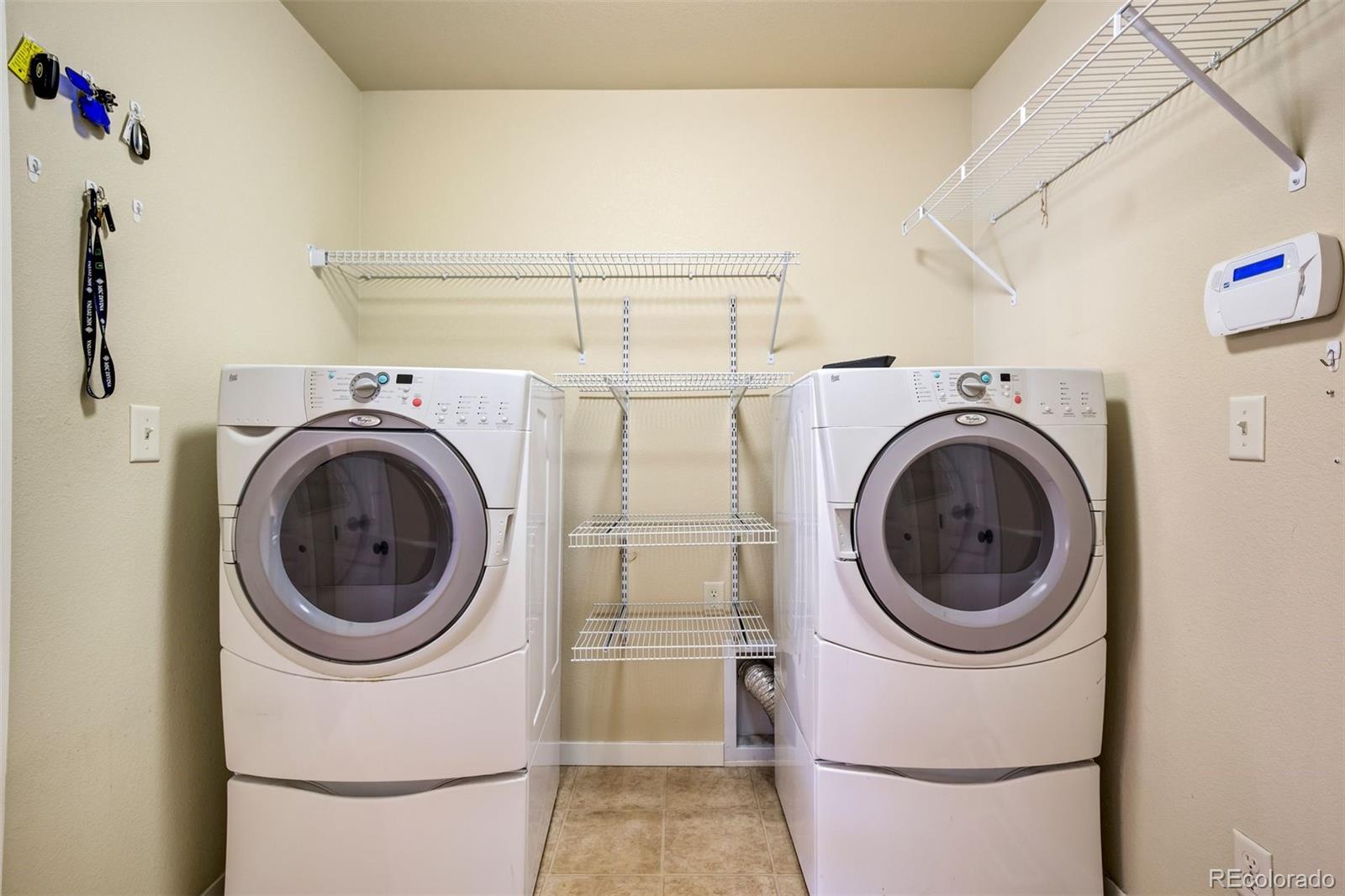 4970 Rabbit Mountain Court Colorado Springs, CO 80924 - Photo 25 of 50 a utility room with dryer and washer