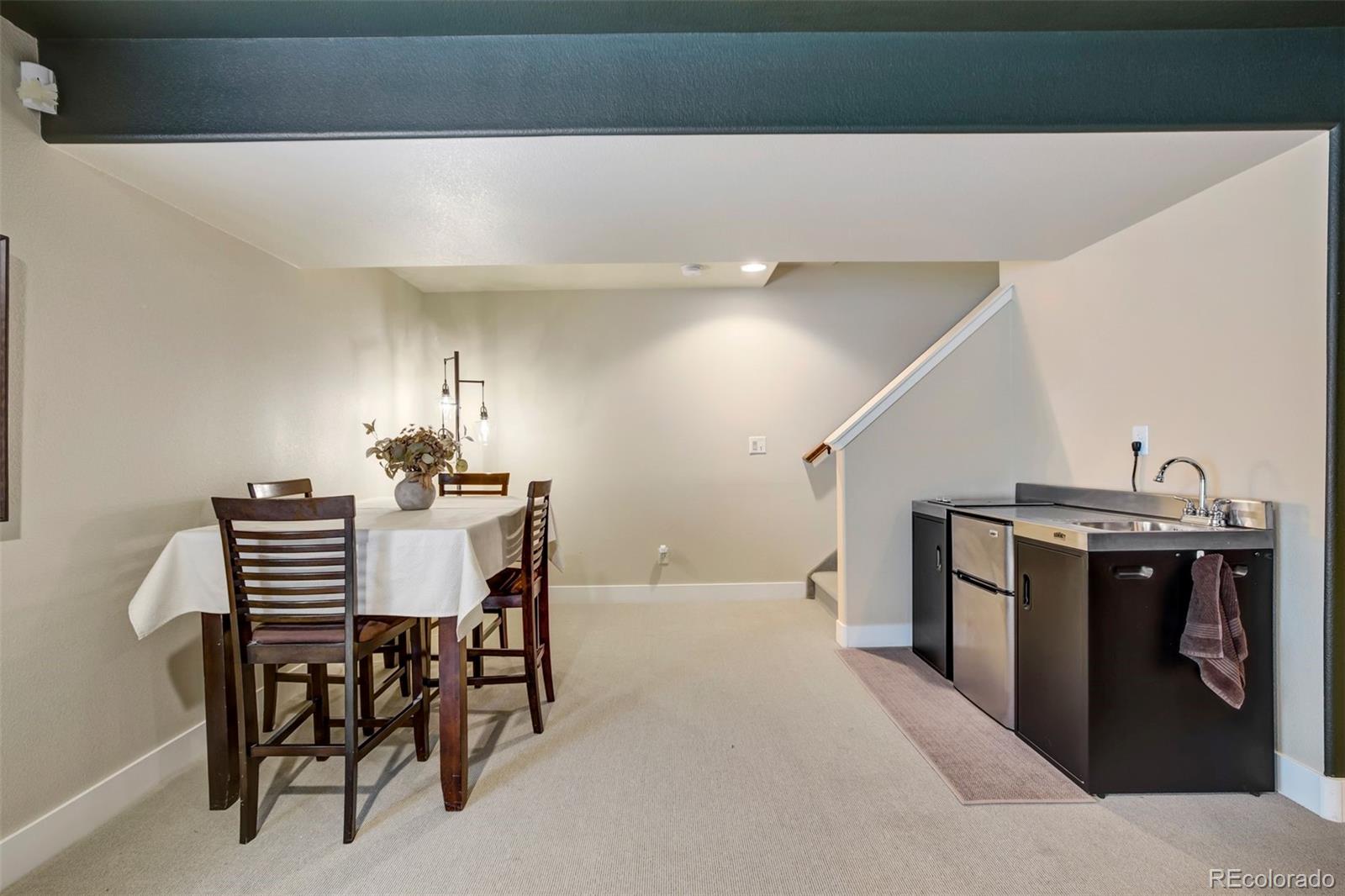 4970 Rabbit Mountain Court Colorado Springs, CO 80924 - Photo 26 of 50 a view of a dining room with furniture and wooden floor