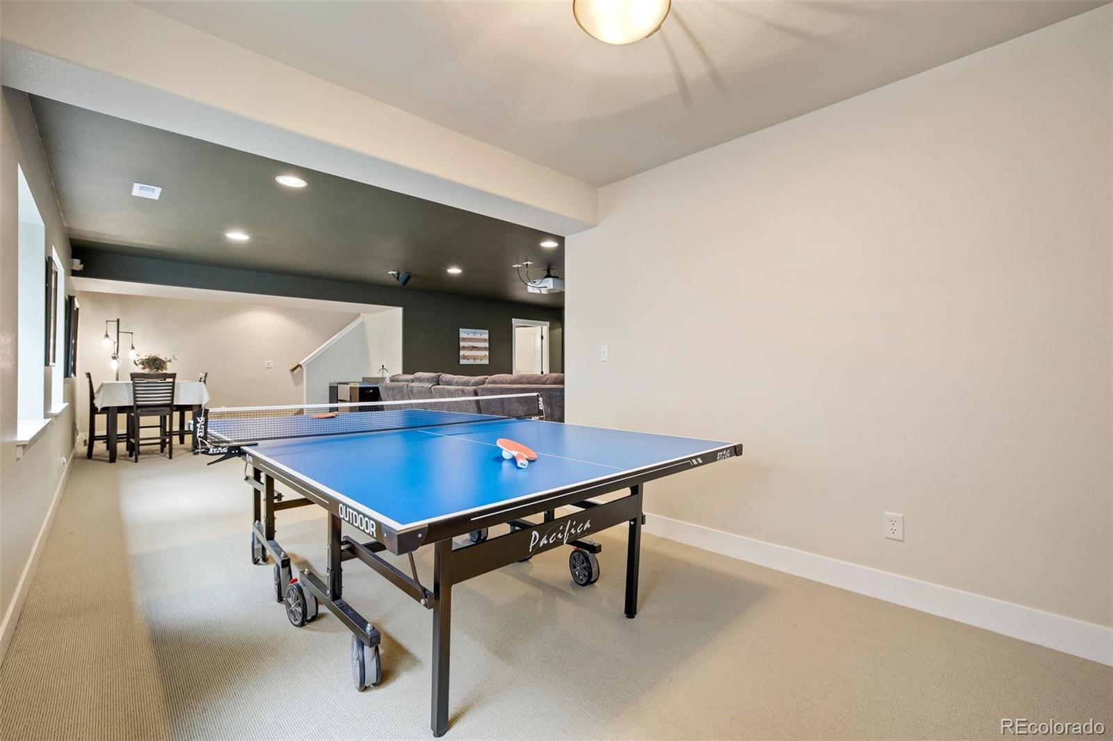 4970 Rabbit Mountain Court Colorado Springs, CO 80924 - Photo 29 of 50 a room with table chairs and a table