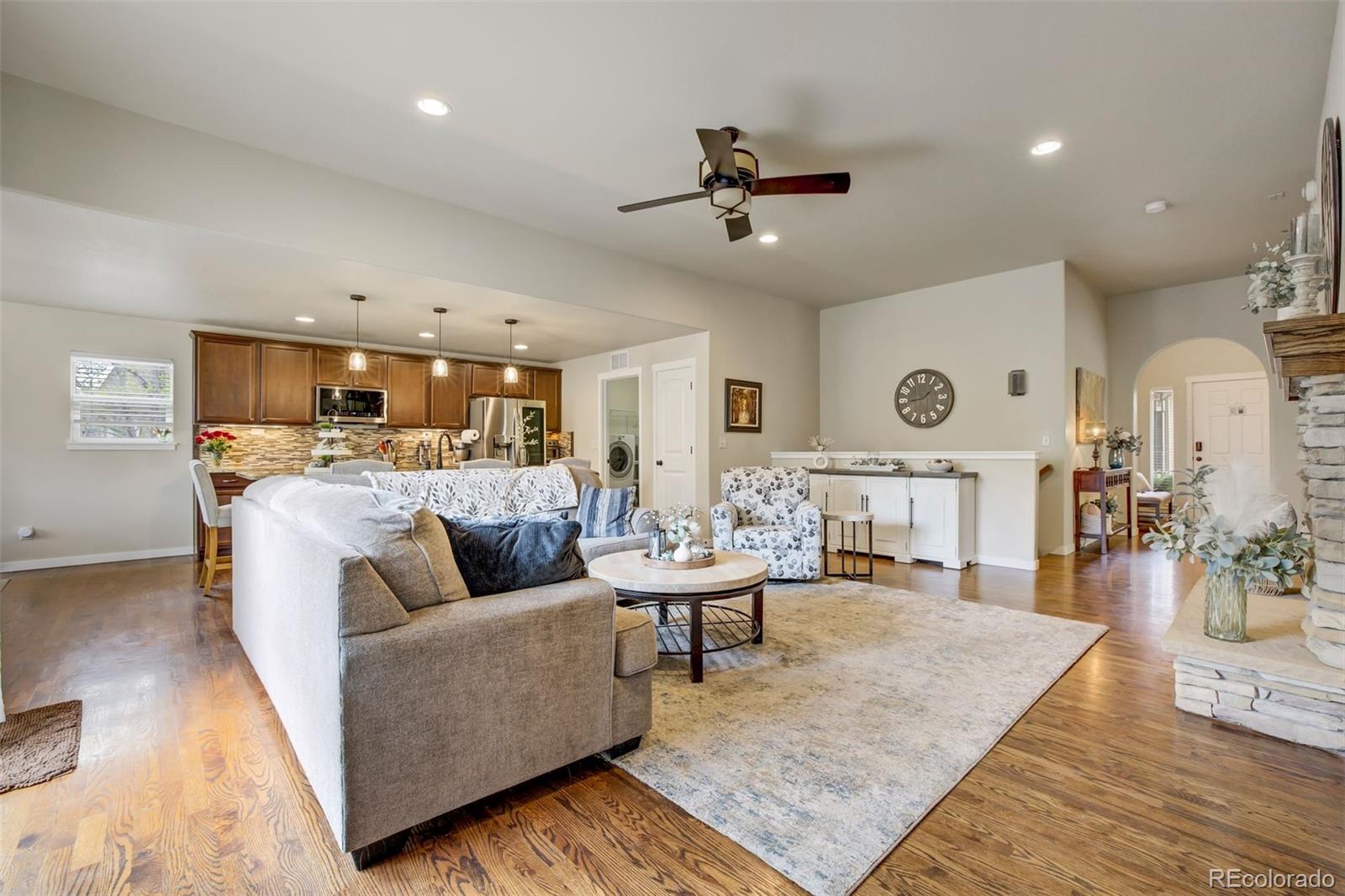 4970 Rabbit Mountain Court Colorado Springs, CO 80924 - Photo 3 of 50 a living room with furniture and wooden floor