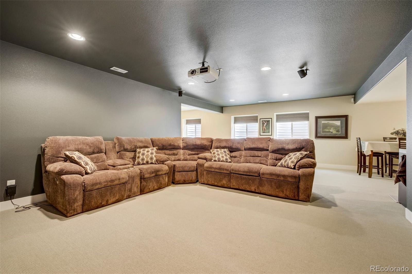 4970 Rabbit Mountain Court Colorado Springs, CO 80924 - Photo 31 of 50 a living room with furniture and a ceiling fan