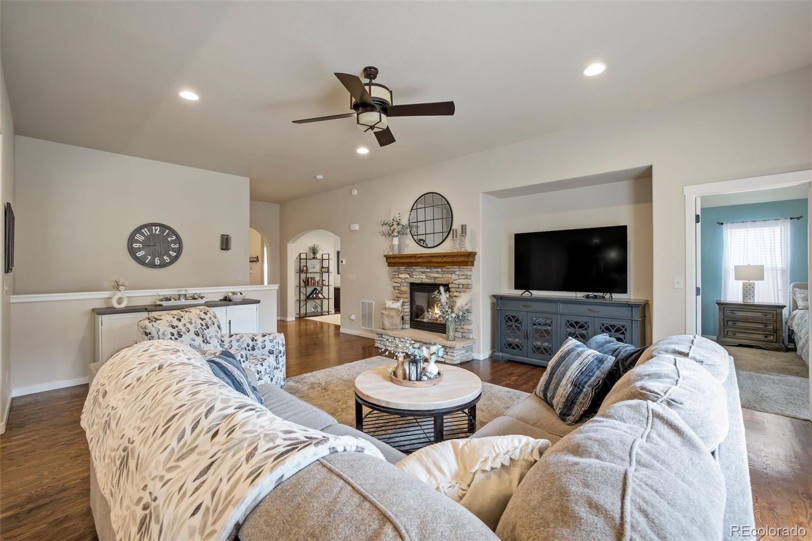 4970 Rabbit Mountain Court Colorado Springs, CO 80924 - Photo 6 of 50 a view of a livingroom with furniture and a fireplace