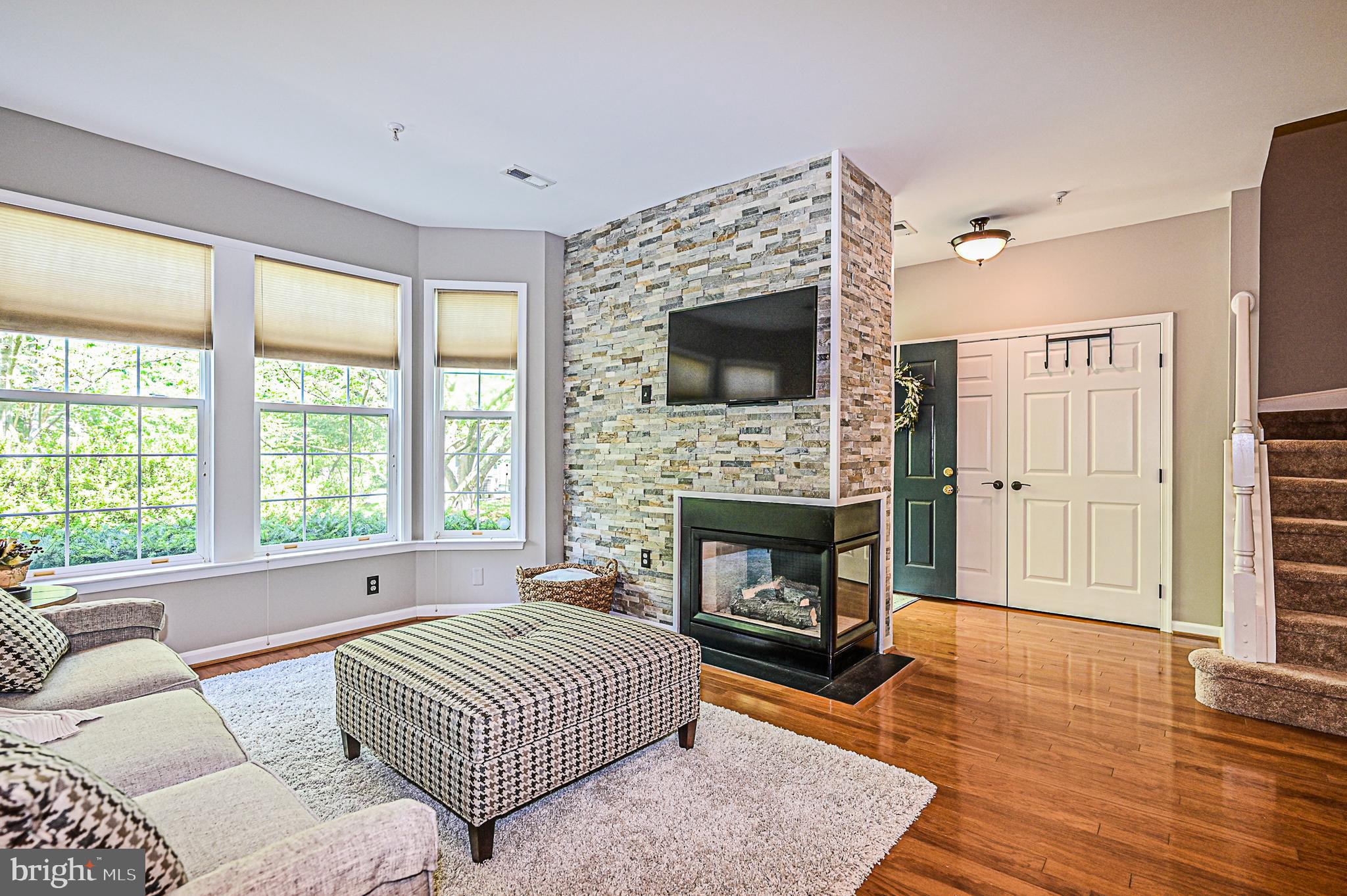 11405 Windleaf Court, Unit B Reston, VA 20194 - Photo 7 of 32 Gas fireplace with beautiful stone surround