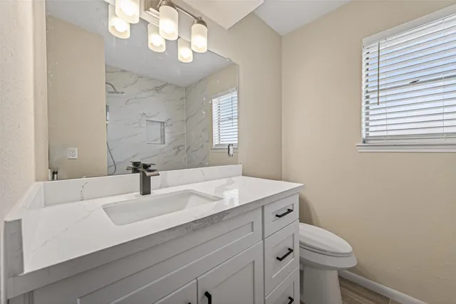 a bathroom with a bathtub and a window