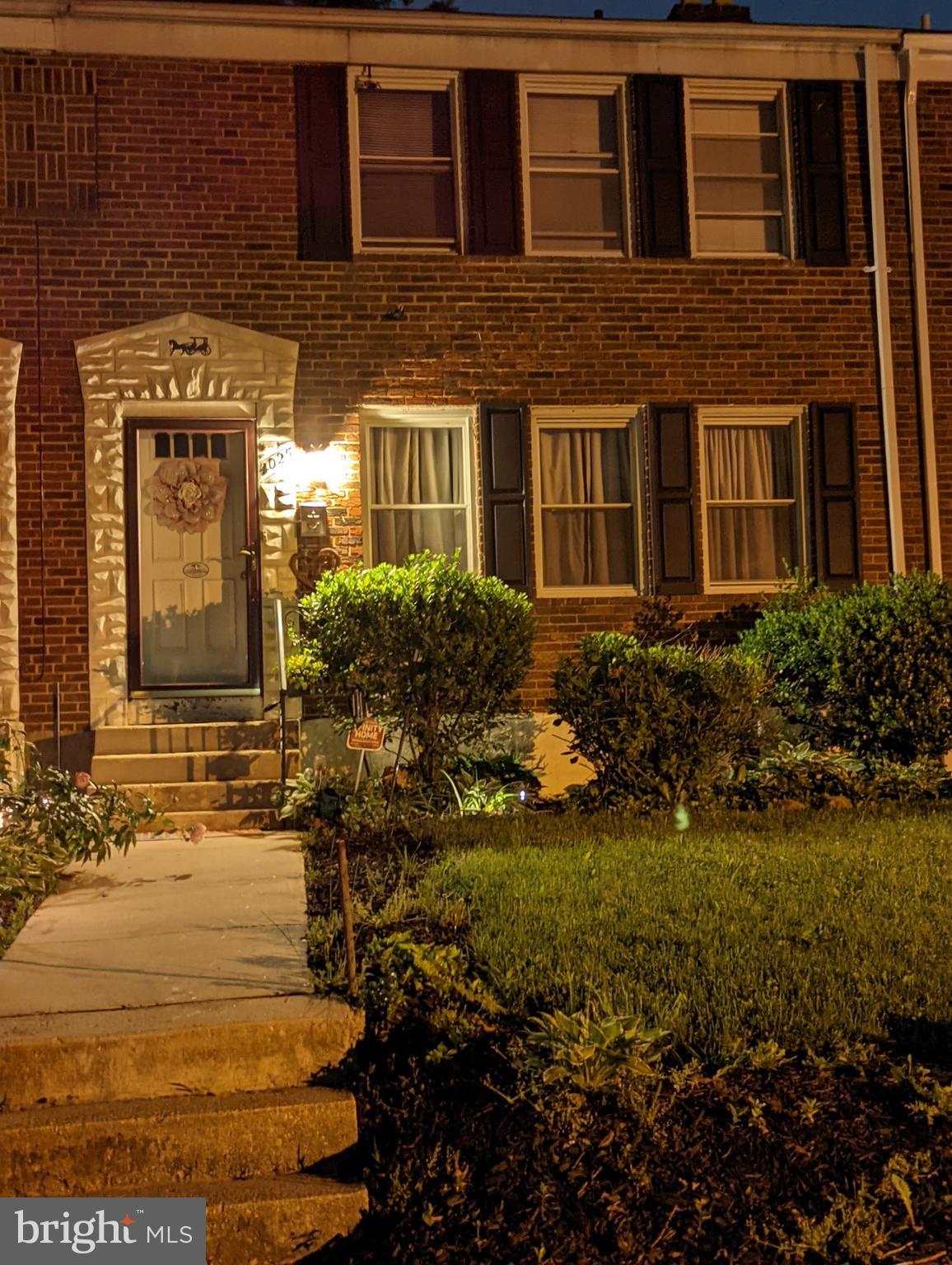 Front with plenty of lighting and landscaping