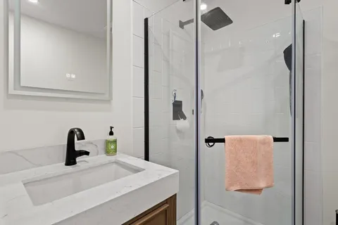a bathroom with a sink and mirror