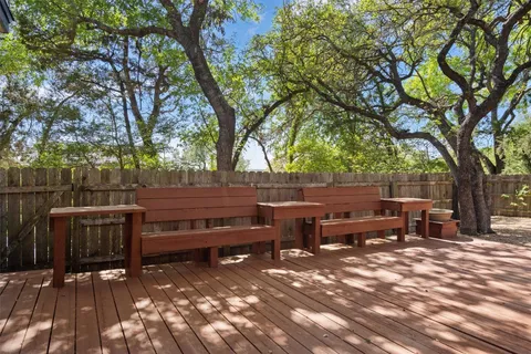 a view of bench sitting in a yard
