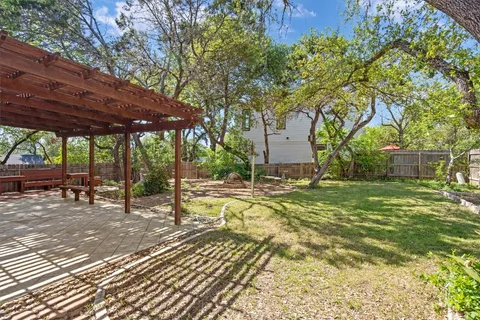 a view of a swimming pool with a patio