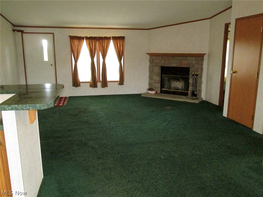11248 Stratton Road West Salem, OH 44287 - Photo 12 of 12 Large open floorplan provides a huge great room with a fireplace.