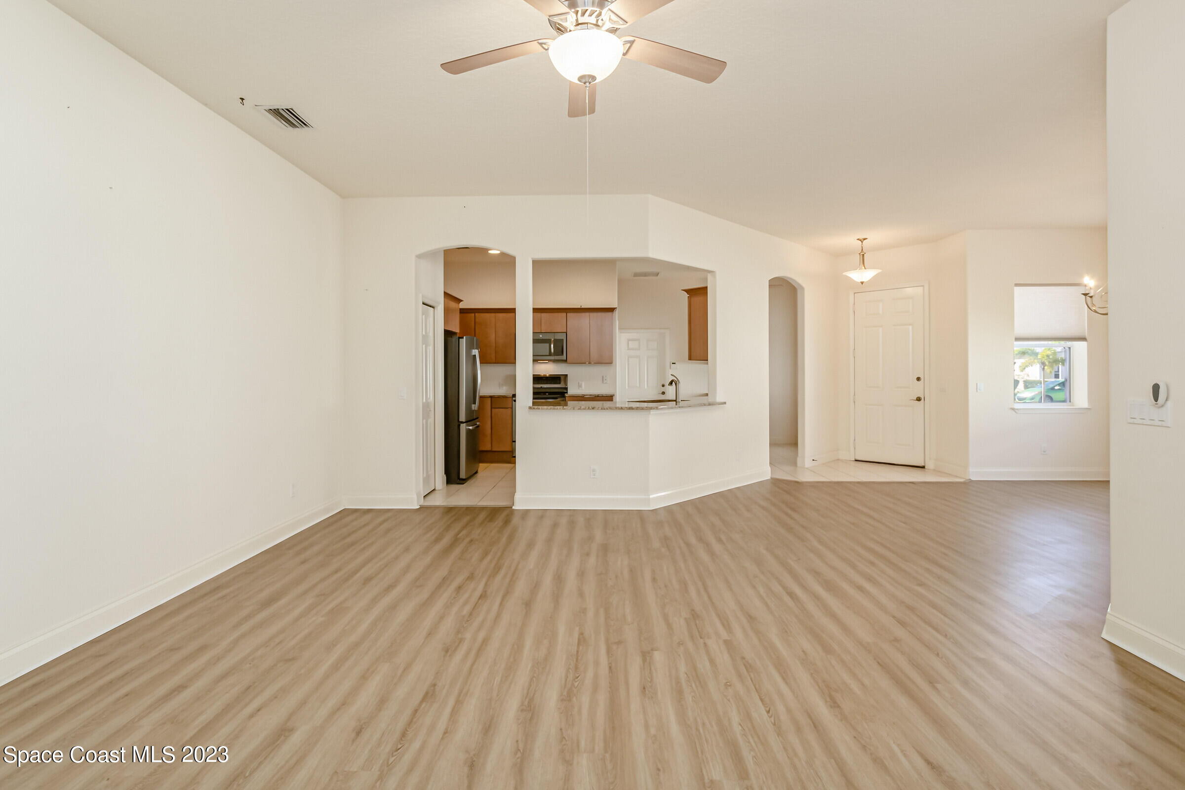 4100 Alamanda Key Drive Melbourne, FL 32901 - Photo 14 of 73 wooden floor in an empty room with a window