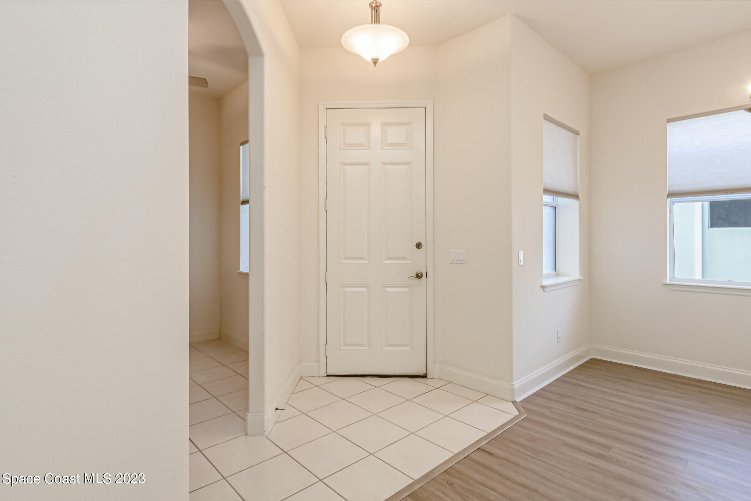 4100 Alamanda Key Drive Melbourne, FL 32901 - Photo 25 of 73 an empty room with wooden floor and bathroom view