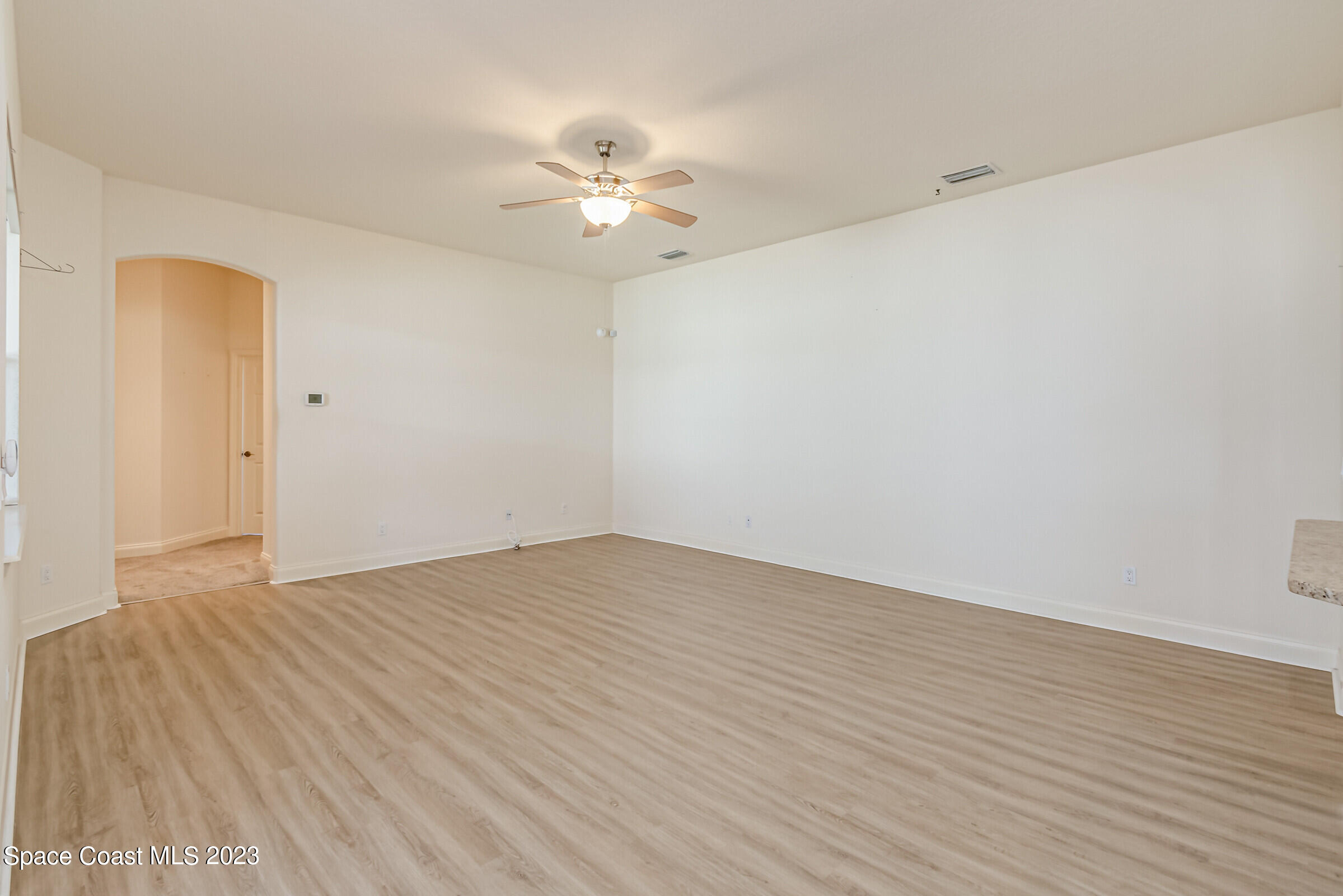 4100 Alamanda Key Drive Melbourne, FL 32901 - Photo 28 of 73 a view of an empty room with wooden floor