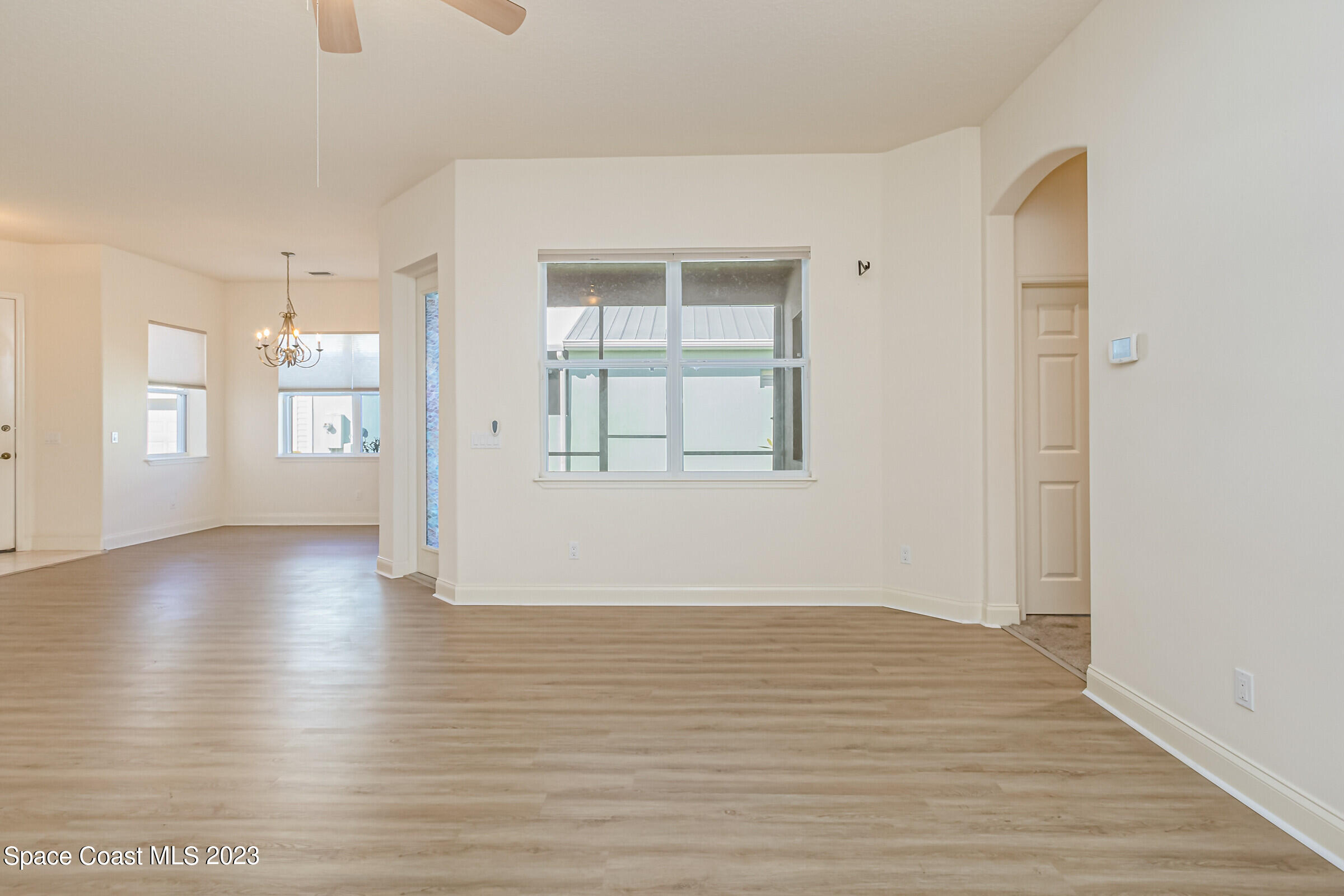 4100 Alamanda Key Drive Melbourne, FL 32901 - Photo 29 of 73 wooden floor in an empty room with a window