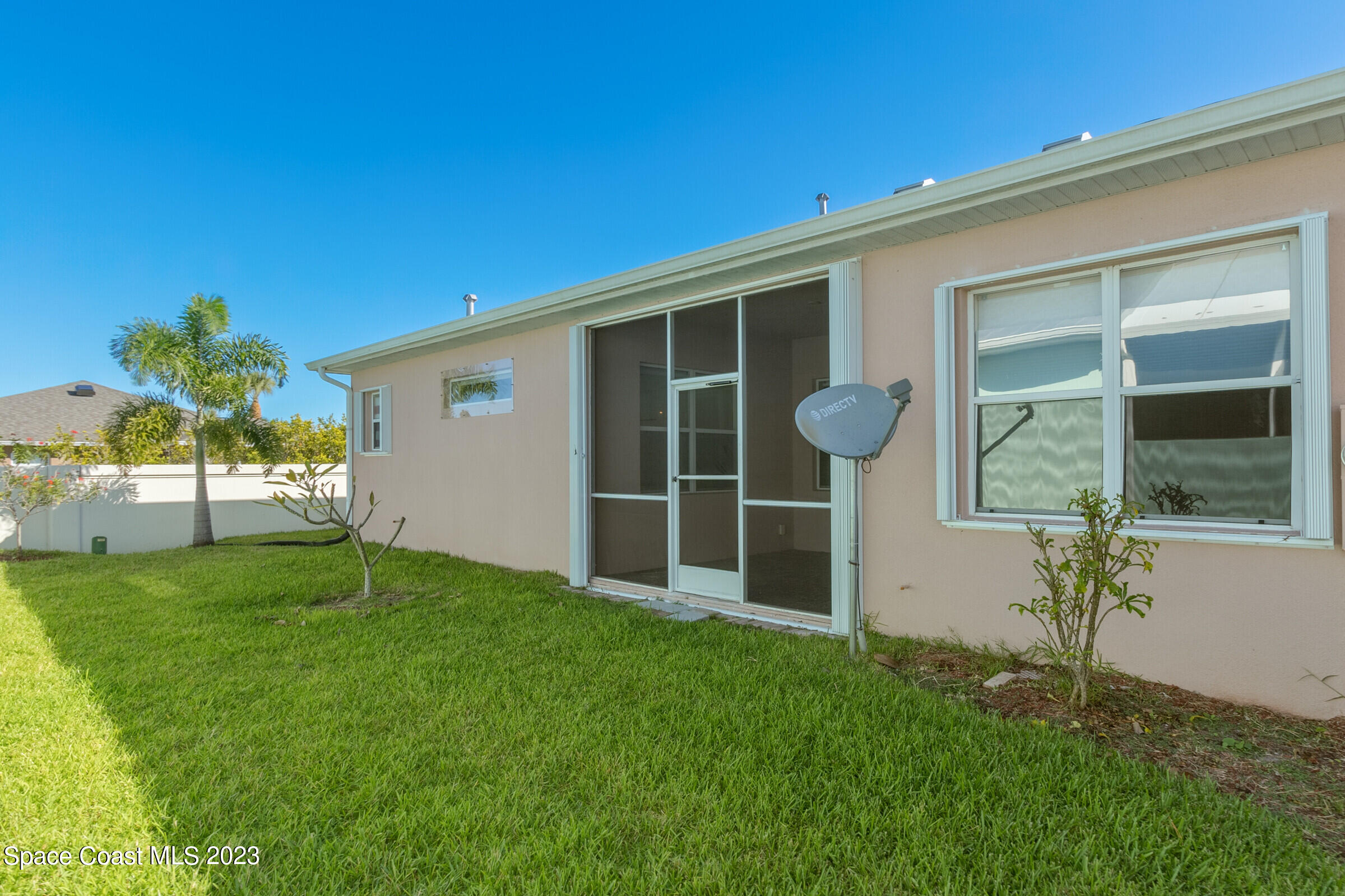 4100 Alamanda Key Drive Melbourne, FL 32901 - Photo 35 of 73 a front view of a house with garden